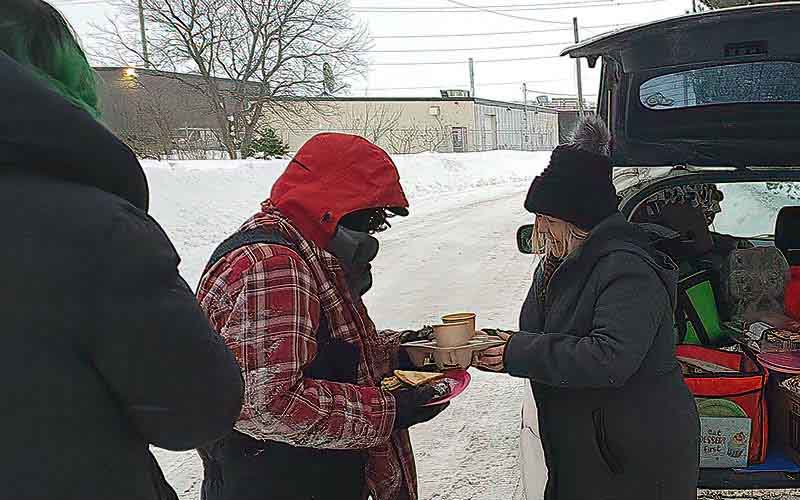 The gift of food and warmth was always appreciated by those in need.