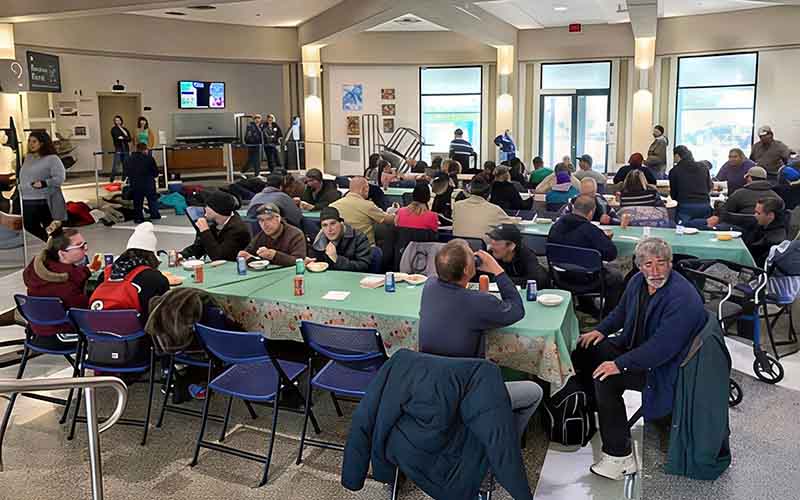 A meal is provided by volunteers in the Barrie City Hall Rotunda.