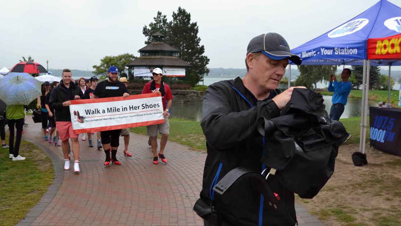 Rain or shine, these men were showing their support for all women