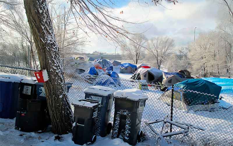 Some cities show compassion, providing garbage service and toilets.